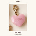 One pink heart charm detail, cropped from AI concept artwork. Not supplier photography.